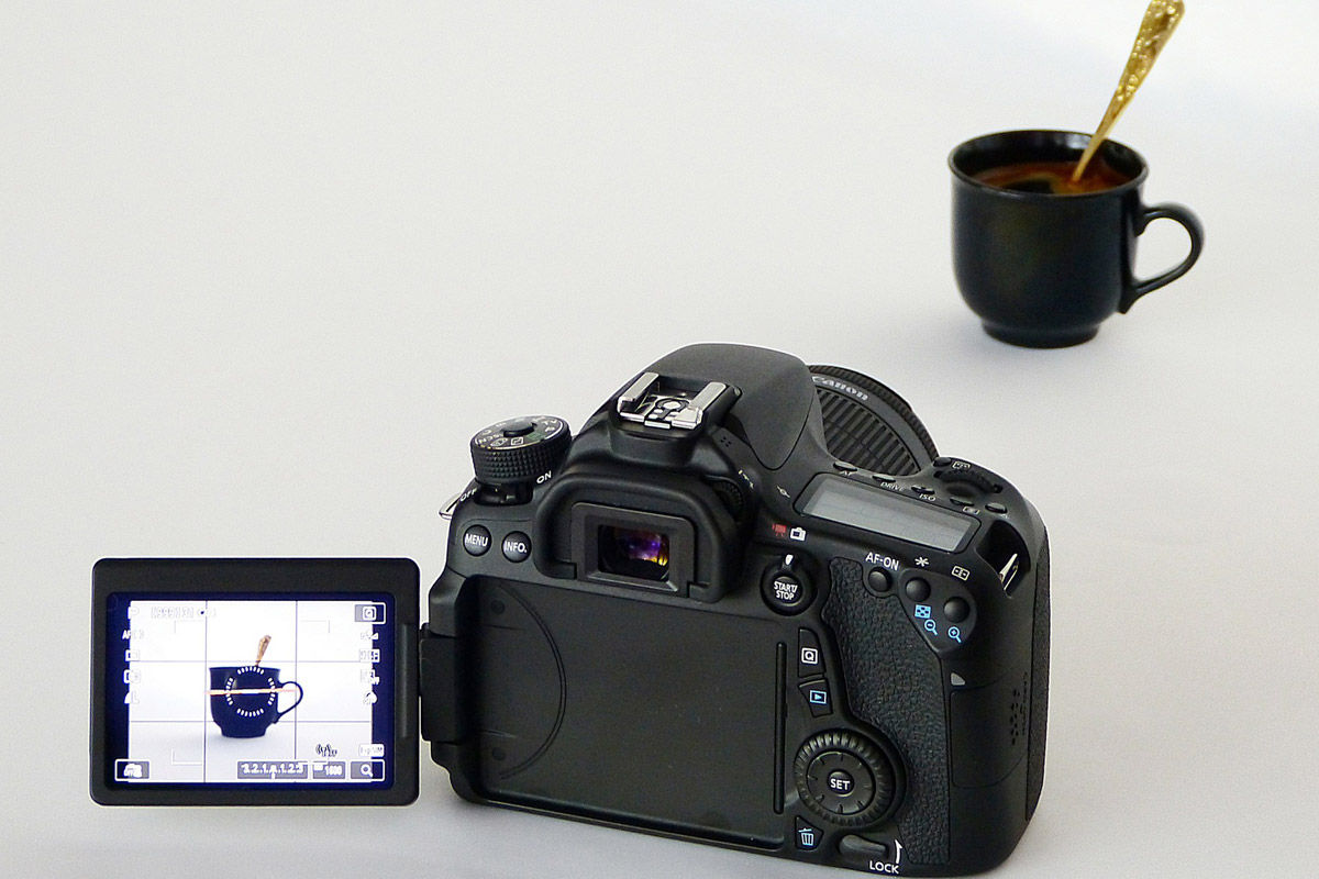 Camera capturing black coffee cup