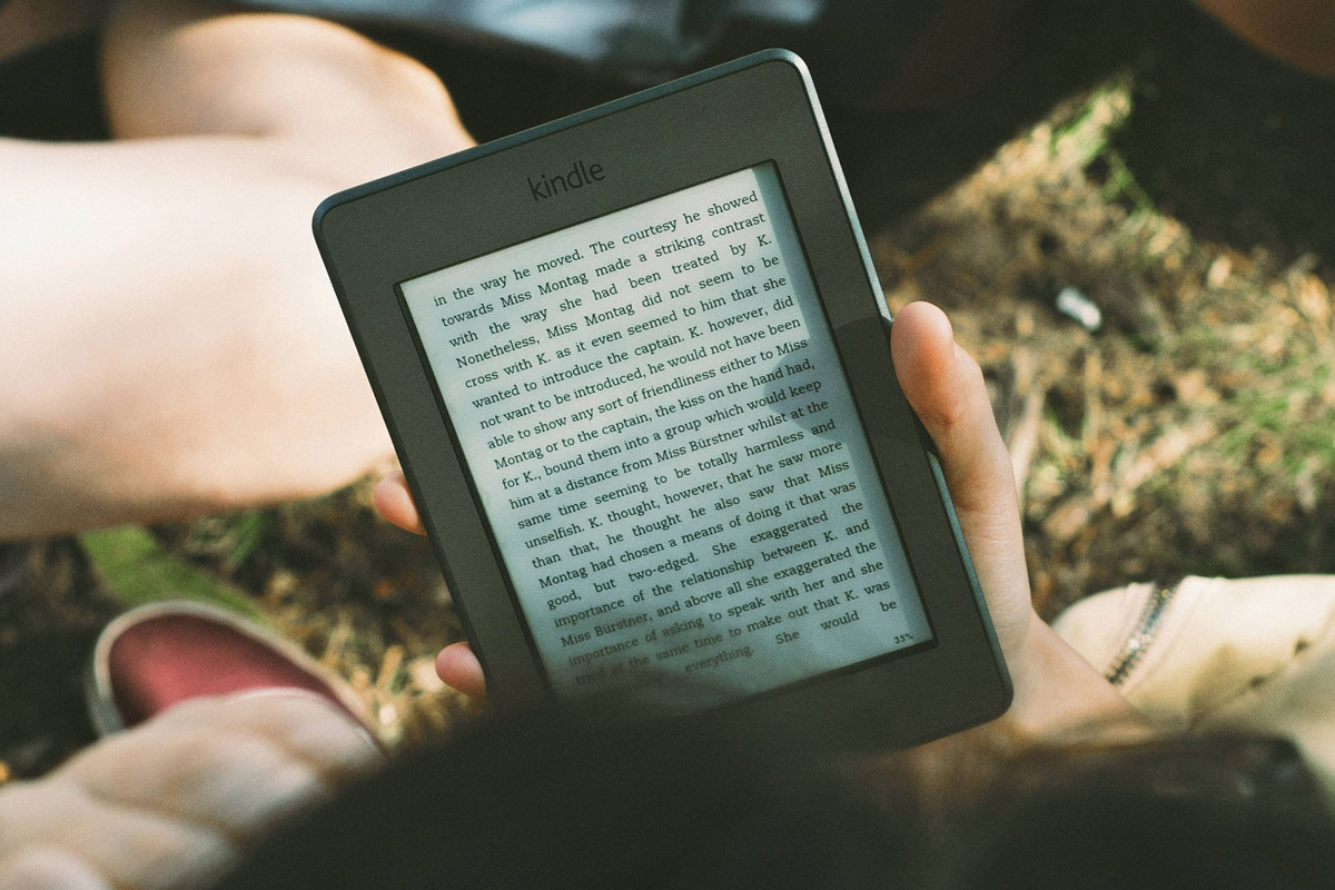 Reader reading on Kindle